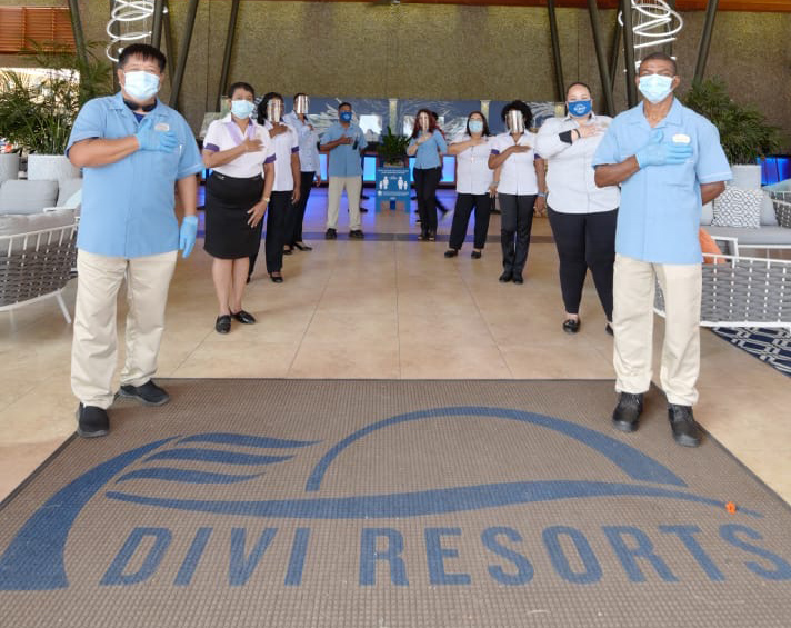 Employees with their hands on their heart together