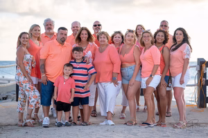 Group of people in pink outfits posing together